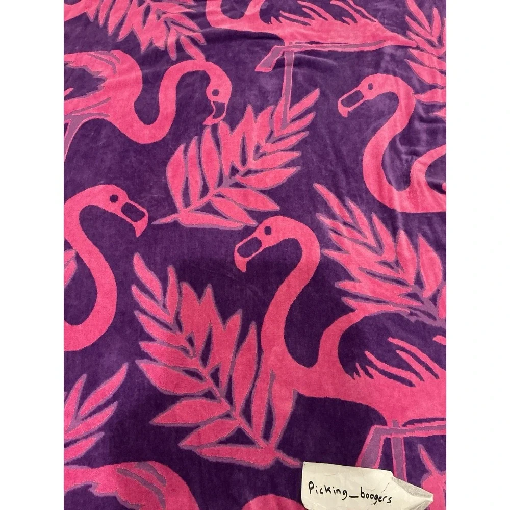 Pink and purple flamingo design cotton beach towel by Jay Franco & Sons